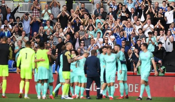 The fans of Brighton & Hove Albion applaud their team at the final whistle during the Premier League match between Brentford and Brighton & Hove...