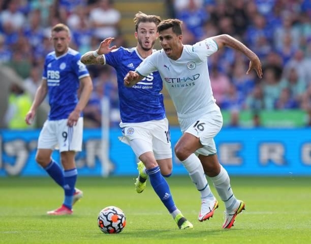 Rodrigo of Manchester City battles for possession with James Maddison of Leicester City during the Premier League match between Leicester City and...