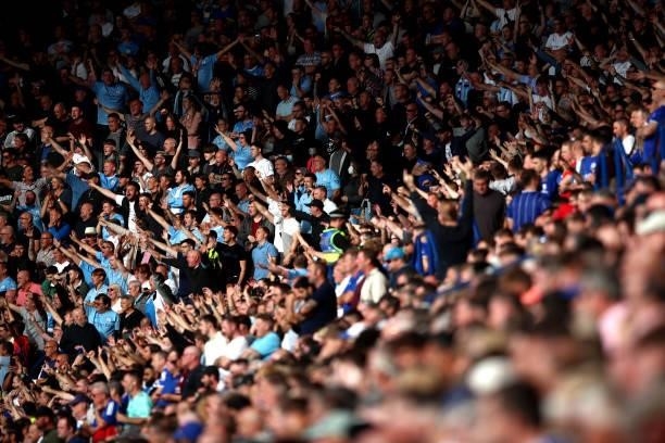 Fans of Manchester City show their support during the Premier League match between Leicester City and Manchester City at The King Power Stadium on...