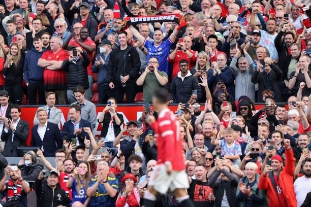 Fans of Manchester United show their support during the Premier League match between Manchester United and Newcastle United at Old Trafford on...