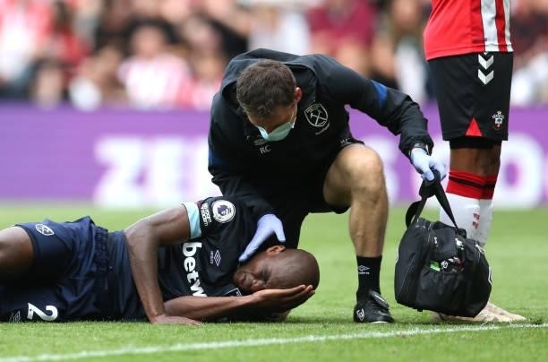 Angelo Ogbonna of West Ham United receives medical treatment during the Premier League match between Southampton and West Ham United at St Mary's...