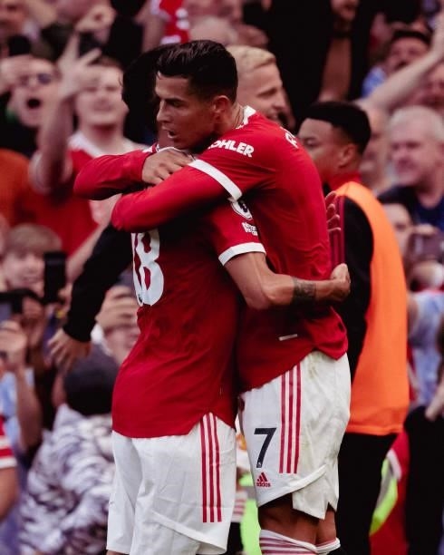 Cristiano Ronaldo of Manchester United celebrates with Bruno Fernandes during the Premier League match between Manchester United and Newcastle United...