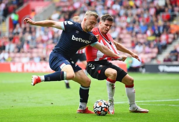 Jarrod Bowen of West Ham United is challenged by Romain Perraud of Southampton during the Premier League match between Southampton and West Ham...