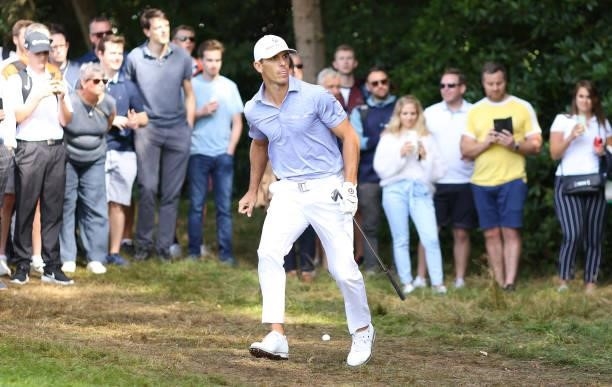Billy Horschel of The USA hots out of the trees on the fourth hole during Day Three of The BMW PGA Championship at Wentworth Golf Club on September...