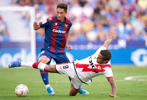 Pablo Martinez of Levante UD competes for the ball with Oscar Trejo of Rayo Vallecano during the La Liga Santander match between Levante UD and Rayo...