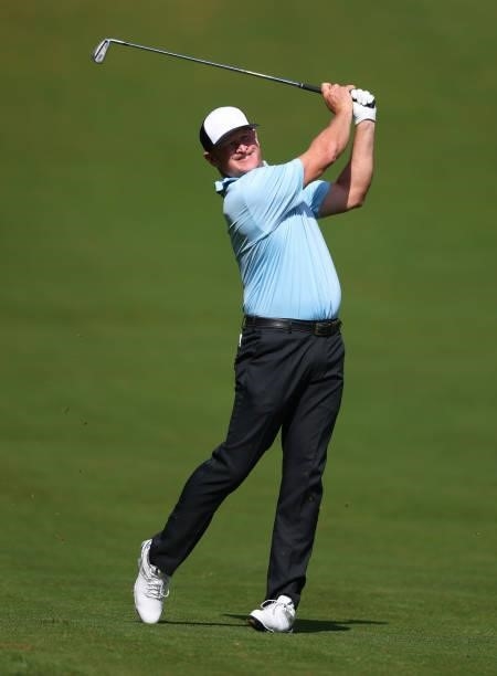 Jamie Donaldson of Wales hits his second shot on the fourth hole during Day Three of The BMW PGA Championship at Wentworth Golf Club on September 11,...