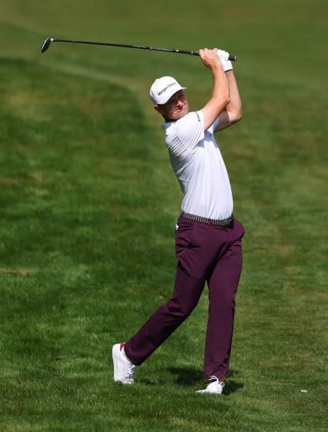 Justin Rose of England hits his second shot on the fourth hole during Day Three of The BMW PGA Championship at Wentworth Golf Club on September 11,...