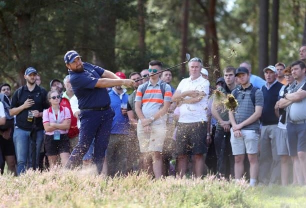 Shane Lowry of Ireland hits his second shot on the 11th hole during Day Three of The BMW PGA Championship at Wentworth Golf Club on September 11,...