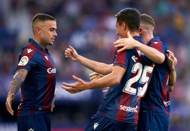 Roger Marti of Levante UD celebrates after scoring his team's first goal with his teammates during the La Liga Santander match between Levante UD and...