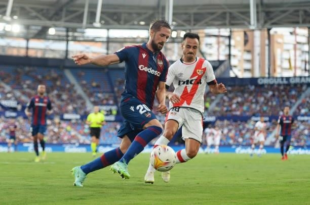 Jorge Miramon of Levante battles for possession with Alvaro Garcia of Rayo Vallecano during the LaLiga Santander match between Levante UD and Rayo...
