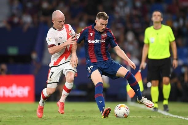 Carlos Clerc of Levante battles for possession with Isi Palazon of Rayo Vallecano during the LaLiga Santander match between Levante UD and Rayo...