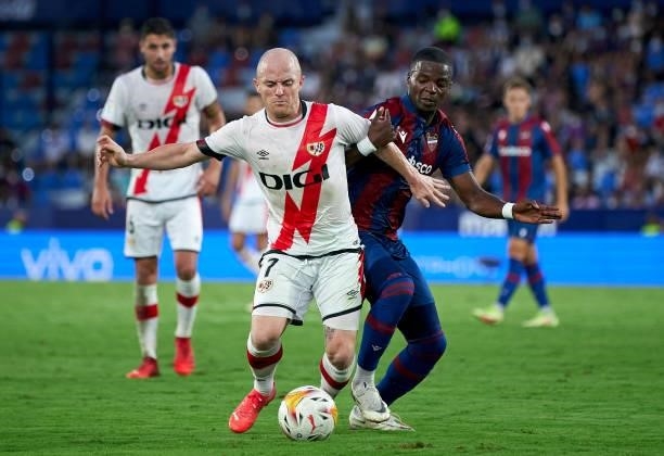 Mickael Malsa of Levante UD competes for the ball with Isi Palazon of Rayo Vallecano during the La Liga Santander match between Levante UD and Rayo...