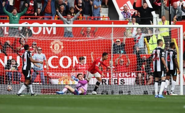 Cristiano Ronaldo of Manchester United celebrates after scoring their side's first goal during the Premier League match between Manchester United and...