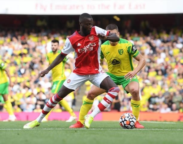 Nicolas Pepe of Arsenal takes on Christos Tzolis of Norwich during the Premier League match between Arsenal and Norwich City at Emirates Stadium on...