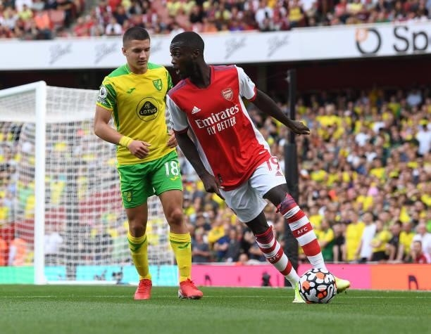 Nicolas Pepe of Arsenal takes on Christos Tzolis of Norwich during the Premier League match between Arsenal and Norwich City at Emirates Stadium on...