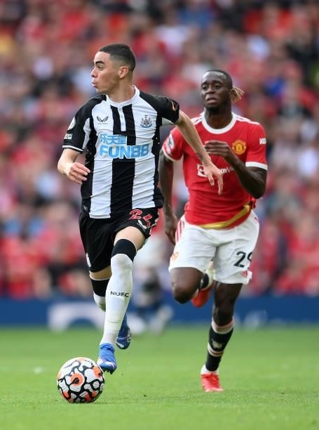 Miguel Almiron of Newcastle United runs with the ball during the Premier League match between Manchester United and Newcastle United at Old Trafford...