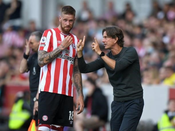 Brentford Head Coach Thomas Frank gives instructions to Pontus Jansson during the Premier League match between Brentford and Brighton & Hove Albion...