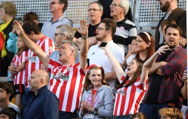 Fans of Brentford during the Premier League match between Brentford and Brighton & Hove Albion at Brentford Community Stadium on September 11, 2021...