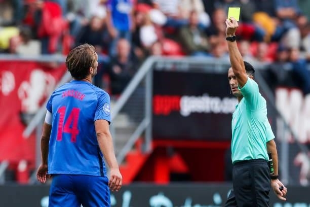 Willem Janssen of FC Utrecht receives a yellow card from referee Serdar Gozubuyuk during the Dutch Eredivisie match between FC Twente and FC Utrecht...