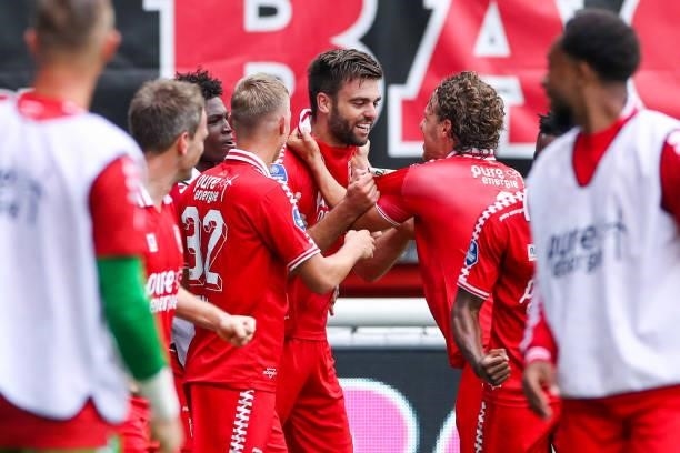 Robin Propper of FC Twente celebrates after scoring his sides first goal with Jesse Bosch of FC Twente and Giovanni Troupee of FC Twente during the...