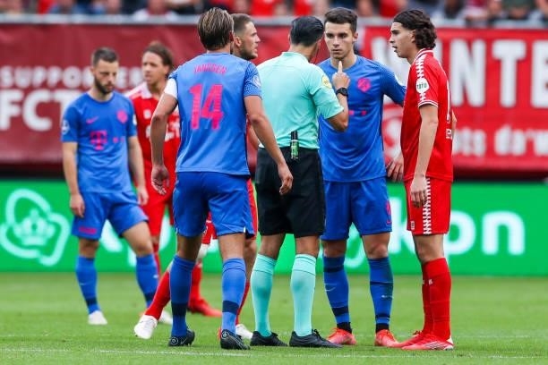 Referee Serdar Gozubuyuk, Anastasios Douvikas of FC Utrecht and Ramiz Zerrouki of FC Twente during the Dutch Eredivisie match between FC Twente and...