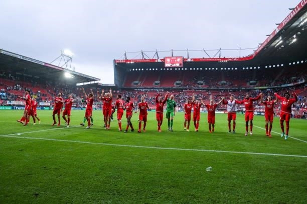 Players of FC Twente celebrating the win with the fans and supporters during the Dutch Eredivisie match between FC Twente and FC Utrecht at Grolsch...