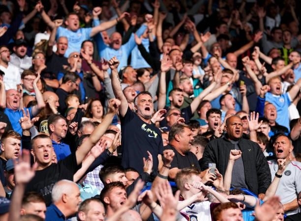 Manchester City fans celebrate during the Premier League match between Leicester City and Manchester City at The King Power Stadium on September 11,...