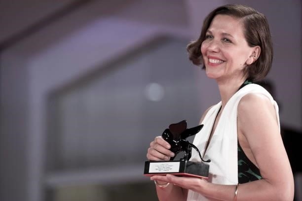 Maggie Gyllenhaal poses with the Award for Best Screenplay for "The Lost Daughter