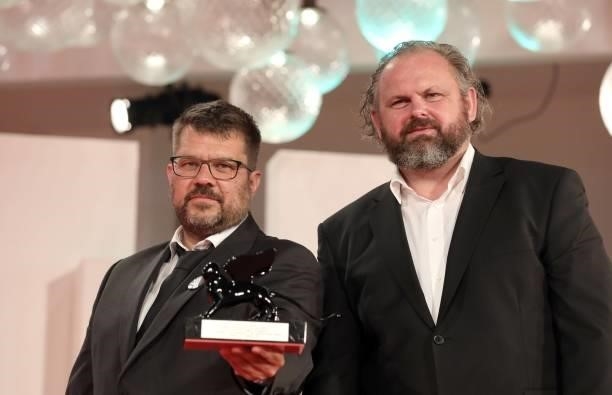 Ivan Ostrochovsky and Peter Kerekes pose with the Orizzonti Award for Best Screenplay for "Cenzorka 