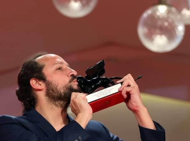 Director Kiro Russo poses with the Special Orizzonti Jury Prize for "El Gran movimento