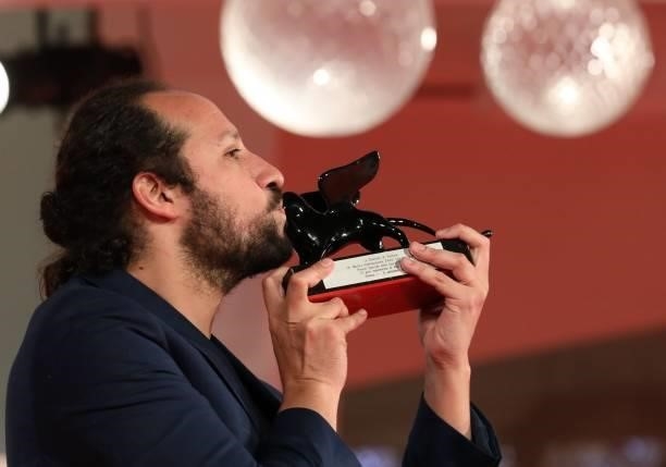 Director Kiro Russo poses with the Special Orizzonti Jury Prize for "El Gran movimento