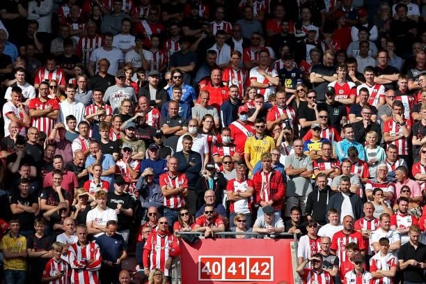 Southampton supporters watch the action during the Premier League match between Southampton and West Ham United at St Mary's Stadium on September 11,...