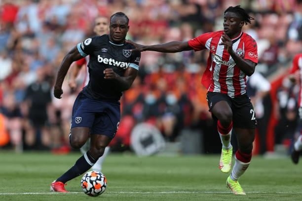Michail Antonio of West Ham United battles for possession with Mohammed Salisu of Southampton during the Premier League match between Southampton and...