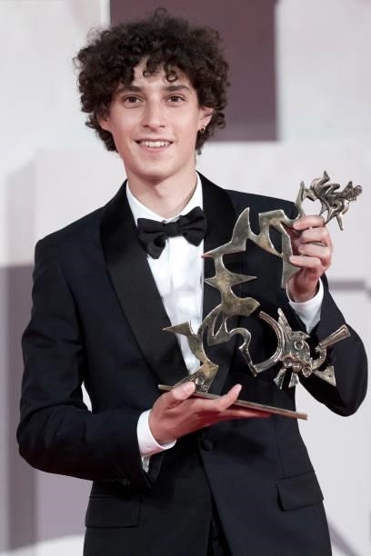 Filippo Scotti poses with Marcello Mastroianni Award for best young promising actor during the awards winner photocall of the 78th Venice...