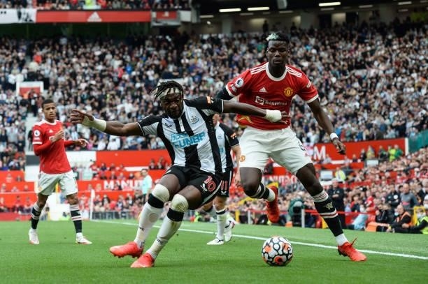 Allan Saint-Maximin of Newcastle United FC and Paul Pogba of Manchester United during the Premier League match between Manchester United and...