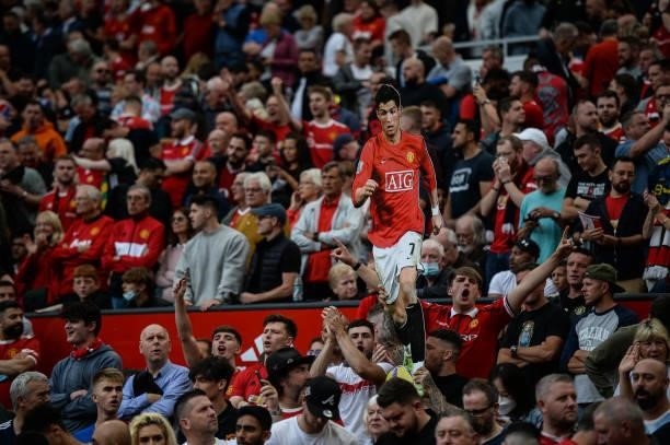 Fans hold up a Cristiano Ronaldo of Manchester United cardboard cut out during the Premier League match between Manchester United and Newcastle...