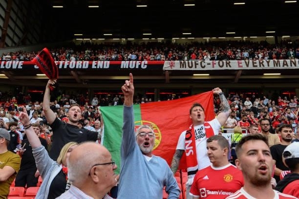 Manchester United fans during the Premier League match between Manchester United and Newcastle United at Old Trafford on September 11, 2021 in...