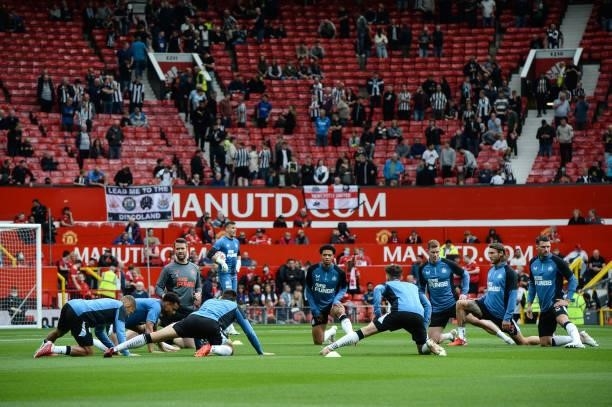 Newcastle players warm up during the Premier League match between Manchester United and Newcastle United at Old Trafford on September 11, 2021 in...