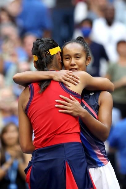 Emma Raducanu of Great Britain and Leylah Annie Fernandez of Canada embrace after Raducanu's win during the second set of their Women's Singles final...