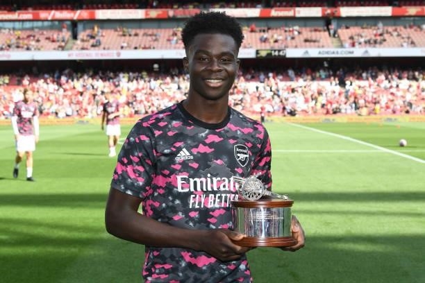 Bukayo Saka receive the Arsenal player of the season award the Premier League match between Arsenal and Norwich City at Emirates Stadium on September...