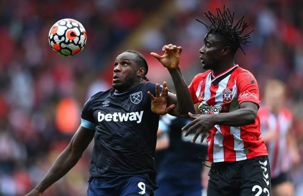 Michail Antonio of West Ham United challenges Mohammed Salisu of Southampton leading to a second yellow and red card during the Premier League match...
