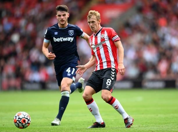 James Ward-Prowse of Southampton passes under pressure from Declan Rice of West Ham United during the Premier League match between Southampton and...