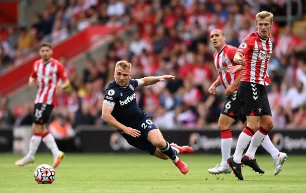 Jarrod Bowen of West Ham United is tackled by James Ward-Prowse of Southampton during the Premier League match between Southampton and West Ham...