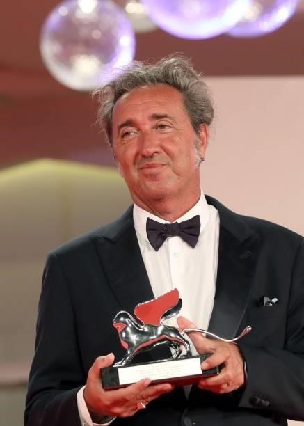 Director Paolo Sorrentino poses with the Silver Lion Grand Jury Prize for "The Hand Of God