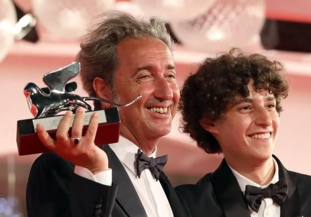 Director Paolo Sorrentino poses with the Silver Lion Grand Jury Prize and Filippo Scotti poses with the Marcello Mastroianni Award for Best New Young...