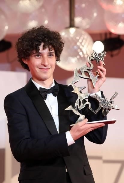 Filippo Scotti poses with the Marcello Mastroianni Award for Best New Young Actor for "The Hand Of God