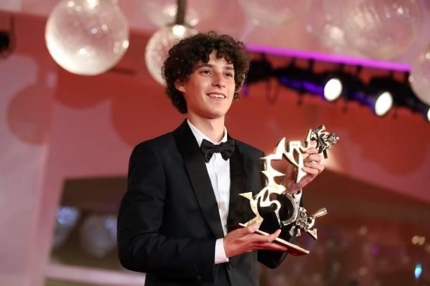 Filippo Scotti poses with the Marcello Mastroianni Award for Best New Young Actor for "The Hand Of God