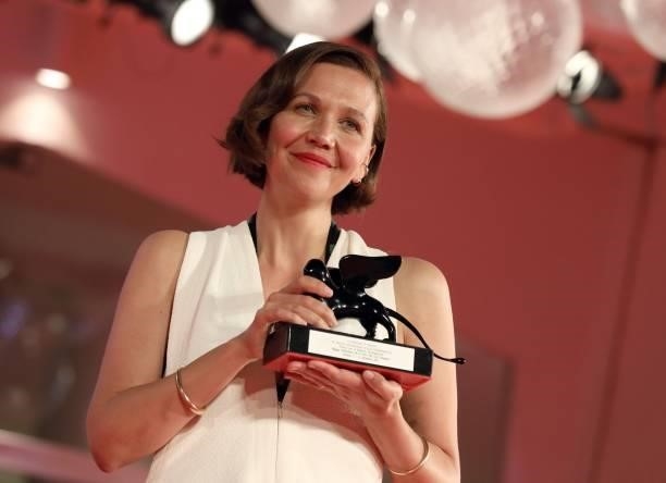 Maggie Gyllenhaal poses with the Award for Best Screenplay for "The Lost Daughter