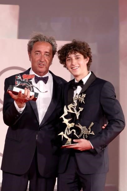 Director Paolo Sorrentino and Filippo Scotti pose with the Silver Lion Grand Jury Prize and the Marcello Mastroianni Award for Best New Young Actor...
