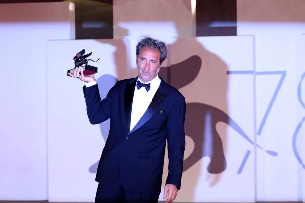 Director Paolo Sorrentino poses with the Silver Lion Grand Jury Prize for "The Hand Of God